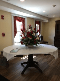Welcoming Entrance and Large Table with Flower Arrangement